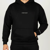 Celvian Distinctive black hoodie, front view highlighting embroidered chest and sleeve logos, kangaroo pocket, studio lighting.