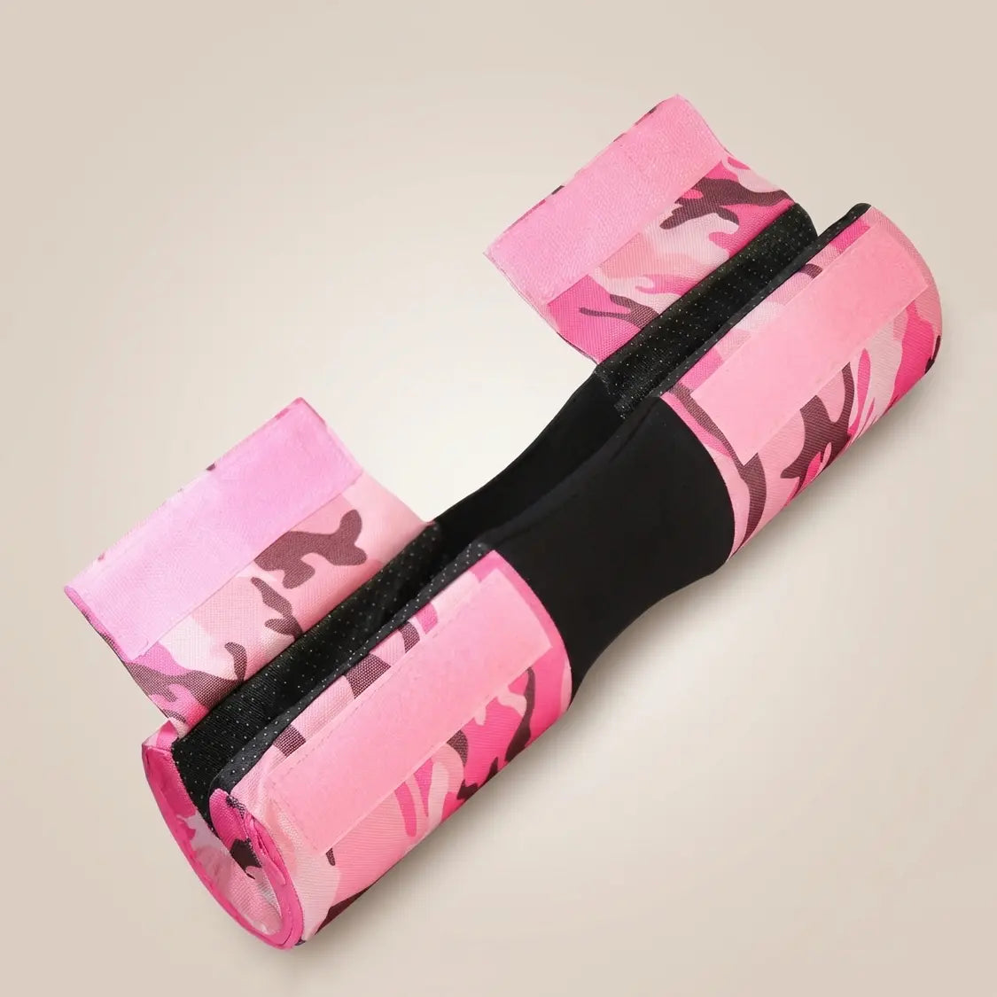 Celvian barbell pad in rose quartz camo with a pink camouflage pattern, black center panel, and pink hook-and-loop straps.