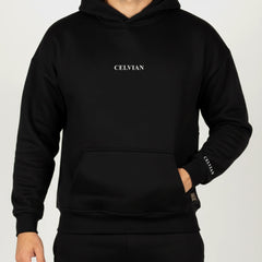 Celvian Distinctive black hoodie, front view highlighting embroidered chest and sleeve logos, kangaroo pocket, studio lighting.
