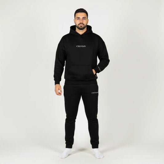 Man wearing a black tracksuit with 'CELVIAN' branding on a white background 4096